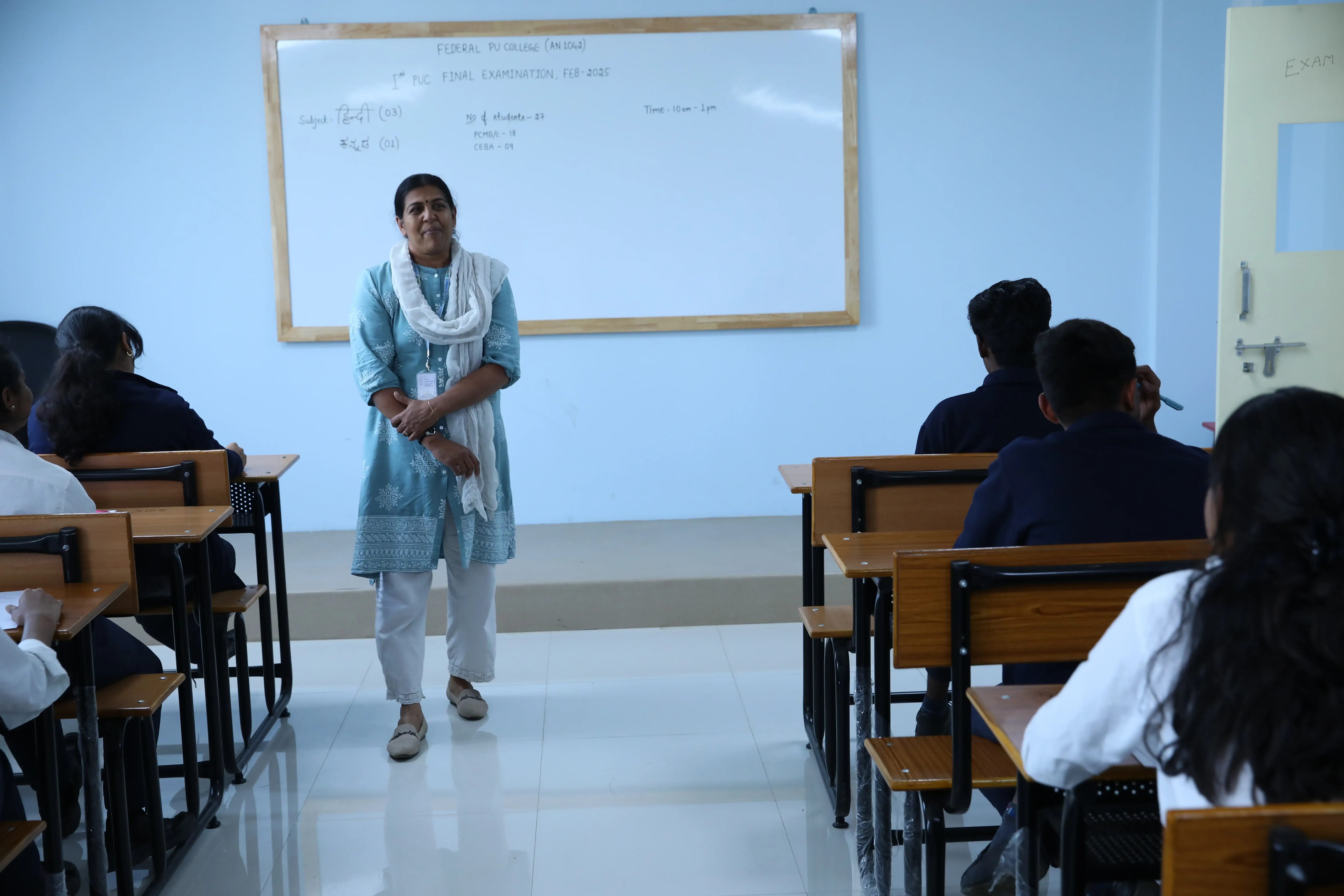 Teacher lecturing students at the best Integrated PU College in Bangalore